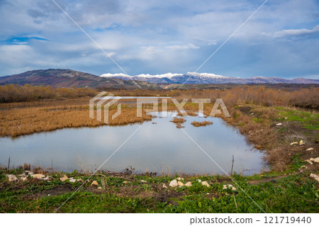 Landscape view of Salina nature park with flamingos near Ulcinj town in winter time in Montenegro 121719440