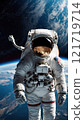 An astronaut floating in space, with Earth and clouds visible below. 121719714