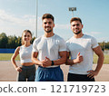 Athletes standing on a track, embodying fitness and determination. 121719723