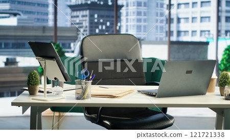 Modern work environment in a urban corporation downtown building, high end workspace with business analytics trends running on screen. Career development, office life concept. Modern work environment in a urban corporation downtown building, high end workspace with business analytics trends running on screen. Career development, office life concept. 121721338