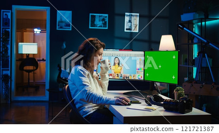Content specialist uses graphic design skills to make social media post on green screen computer for advertising company. Photo editor using chroma key PC monitor to create promotional image, camera B Content specialist uses graphic design skills to make social media post on green screen computer for advertising company. Photo editor using chroma key PC monitor to create promotional image, camera B 121721387