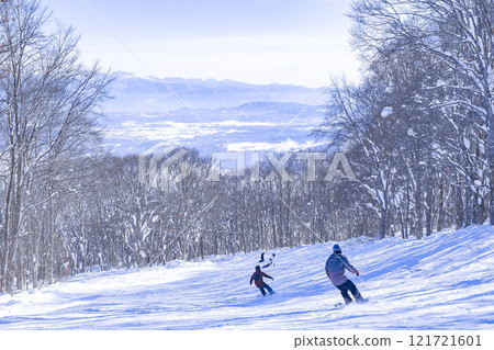 People skiing at a ski resort 121721601