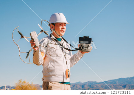 Workers preparing a drone for flight 121723111