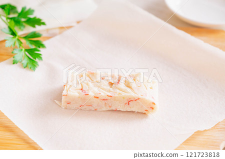 Frozen crab cream sauce wrapped in spring roll wrappers Frozen crab cream sauce wrapped in spring roll wrappers 121723818