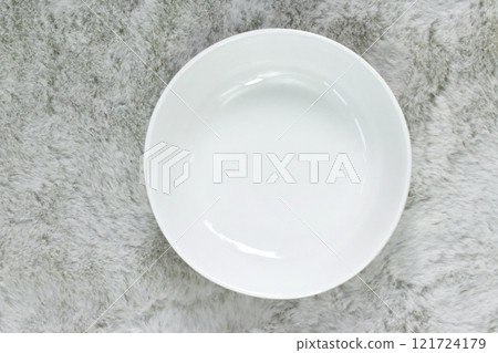 Fluffy grey material with white plate Fluffy grey material with white plate 121724179