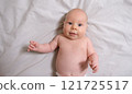 Joyful Two-Month-Old Baby Boy on a Light Background. Selective Focus 121725517