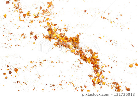 dried red chili pepper flakes and seeds isolated on white background 121726018