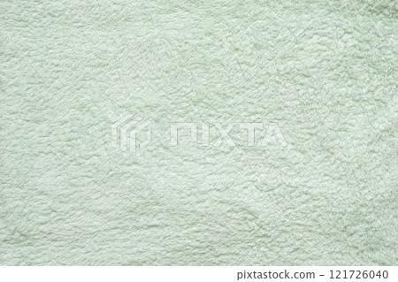 Green fluffy towel fabric soft texture background Green fluffy towel fabric soft texture background 121726040