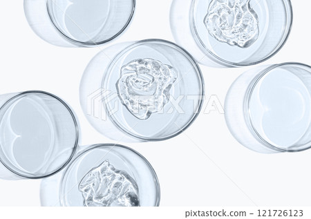 Skin serum or face wash gel in a Petri dish. For cosmetic procedures. White background Skin serum or face wash gel in a Petri dish. For cosmetic procedures. White background 121726123