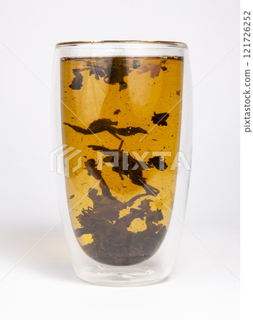 Tea in double glass cup on the white background 121726252