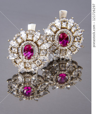Diamond earrings with pink stone luxury jewerly macro close up Diamond earrings with pink stone luxury jewerly macro close up 121726297