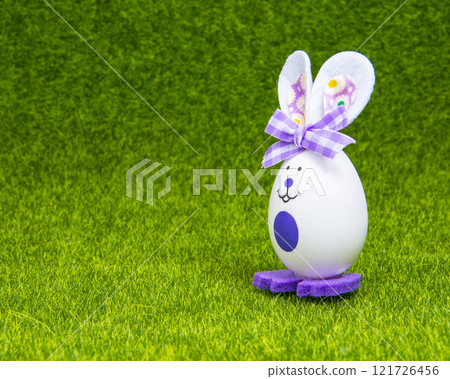Easter handmade toy bunny egg no trademark on green grass bright holiday 121726456