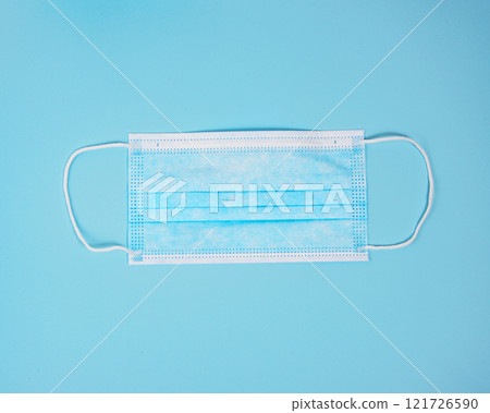 Medical breath clinic filter mask on blue background 121726590