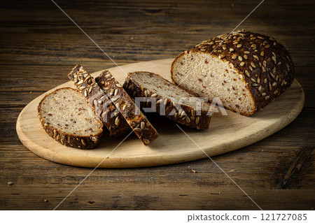 sliced bread on wooden table 121727085