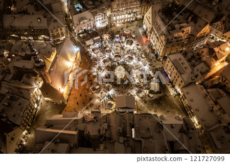 Aerial night View of Tallinn with the Town Hall Square in winter, roofs with snow, Christmas mood 121727099