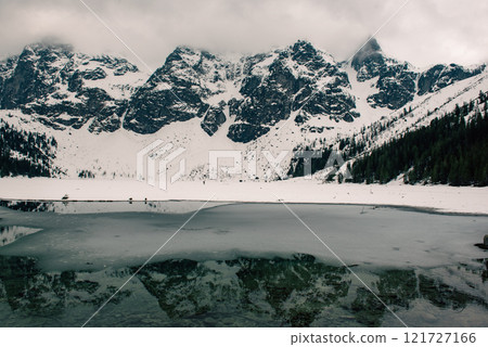 Frozen Lake Morskie Oko or Sea Eye Lake in Poland at Winter. Frozen Lake Morskie Oko or Sea Eye Lake in Poland at Winter. 121727166
