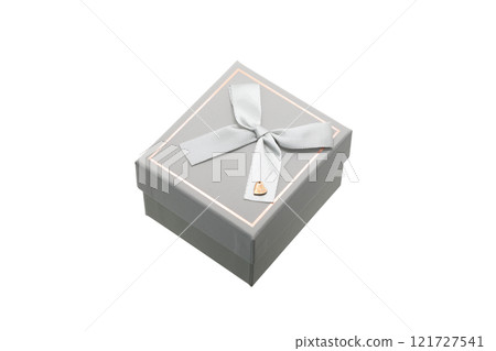 small grey gift box with ribbon on white isolated background small grey gift box with ribbon on white isolated background 121727541