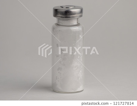 Simple glass vial with a metal cap. High quality photo Simple glass vial with a metal cap. High quality photo 121727814