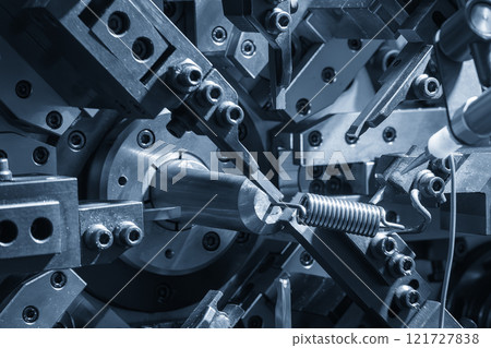 Close up scene operation of the coil spring making machine. Close up scene operation of the coil spring making machine. 121727838