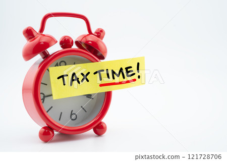 Tax time post it at red alarm clock. Tax time post it at red alarm clock. 121728706