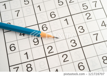 Sudoku puzzle game playing to challenge brain. 121728707