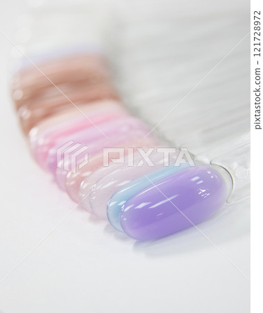 Multicolor different palette gel varnishes examples for manicure on the white background Multicolor different palette gel varnishes examples for manicure on the white background 121728972
