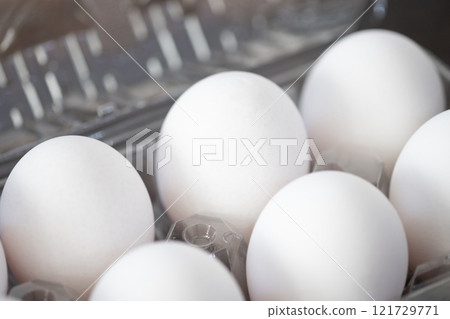 Raw eggs in a pack (stock photo) 121729771