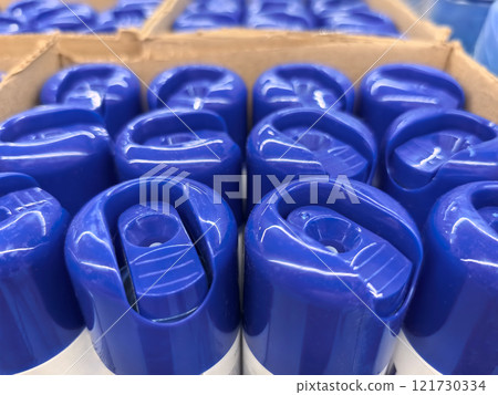 Bottles lined up in a factory awaiting shipment for daily distribution Bottles lined up in a factory awaiting shipment for daily distribution 121730334