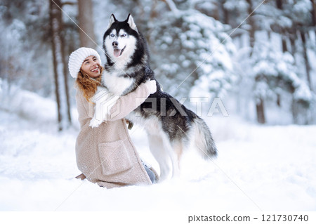 A young woman with her pet on an adventure. Friendship concept, pets. 121730740