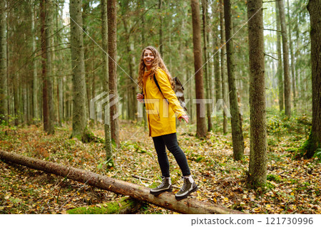 Young woman explores new, fantastic places around world, surrounded by nature relax Active Lifestyle 121730996