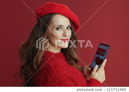 happy woman with long wavy hair, smartphone and Valentine app happy woman with long wavy hair, smartphone and Valentine app 121731400
