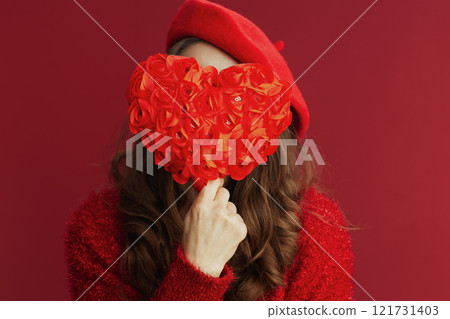 Closeup on woman in red sweater and beret Closeup on woman in red sweater and beret 121731403