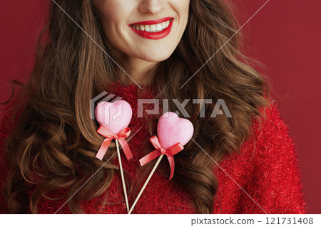 Closeup on smiling woman in red sweater and beret 121731408