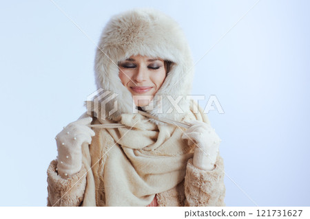 smiling woman in winter coat and fur hat on white smiling woman in winter coat and fur hat on white 121731627