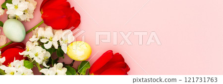 Easter eggs and blossoming apple tree branches and red peonies 121731763