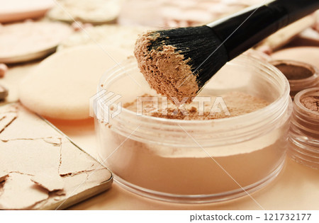 Brush with beauty cosmetics background, varieties of face powders and foundations for perfect complexion, basic make up products to even out and matte skin, selective focus, shallow DOF 121732177