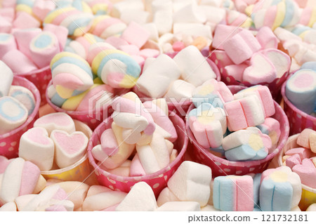 Confectionery and sweeties varieties background: light pink and white marshmallows, sugar confetti, bonbon and candies, selective focus, shallow focus Confectionery and sweeties varieties background: light pink and white marshmallows, sugar confetti, bonbon and candies, selective focus, shallow focus 121732181