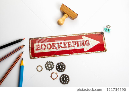 Bookkeeping Concept. Red direction arrow with text on white office desk 121734590