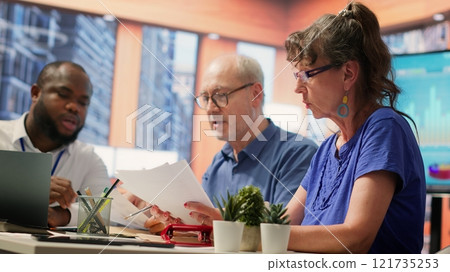 Old people asking for professional advice from financial expert, counseling on retirement plans and investments. Help middle aged pair to invest money and increase income. Maximize savings. Camera A. 121735253