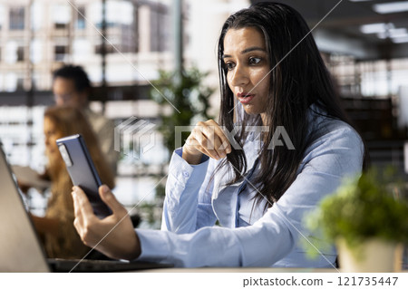 General manager conducting a digital meeting on internet network, focusing on resource allocation and administrative tasks. Virtual collaboration to discuss important business decisions. General manager conducting a digital meeting on internet network, focusing on resource allocation and administrative tasks. Virtual collaboration to discuss important business decisions. 121735447