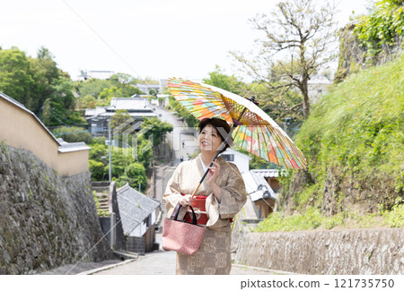 A woman in a kimono standing on Suya Hill, Kitsuki City, Oita Prefecture 121735750