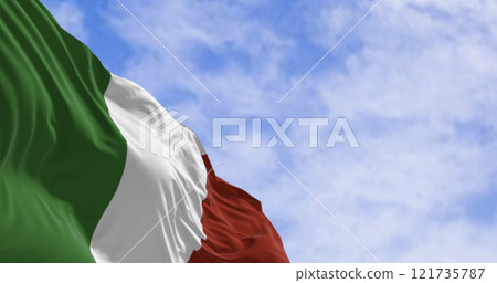 Close-up of the national flag of Italy waving in the wind on a clear day Close-up of the national flag of Italy waving in the wind on a clear day 121735787