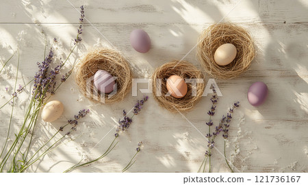 Craft a cozy Easter atmosphere with colorful eggs nestled in straw, complemented by delicate lavender sprigs and soft shadows 121736167