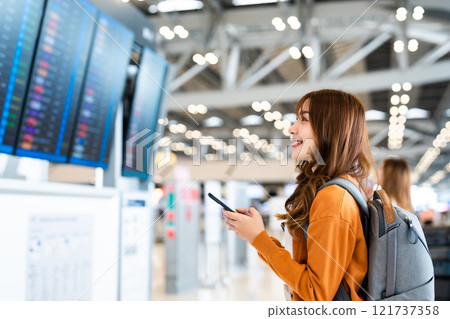 Young asian woman in international airport 121737358