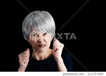 Senior woman distorting her face in anger 121737383