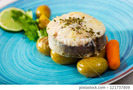 Pollock steak with vegetables 121737809