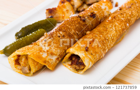 Pancakes with fried chicken breast 121737859