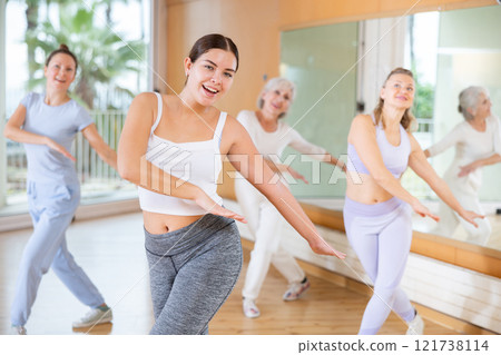 Dance class for people, positive women training in dance studio Dance class for people, positive women training in dance studio 121738114