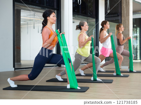 People with working out with rubber bands People with working out with rubber bands 121738185