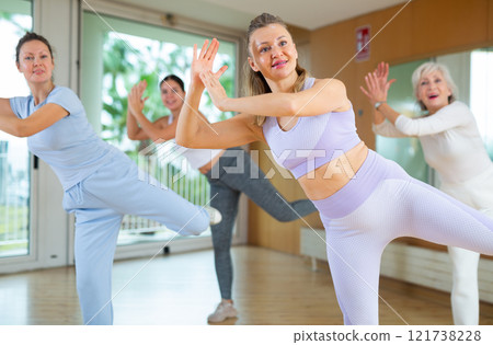 Group are practising arch movement in step jazz dance in fitness gym 121738228
